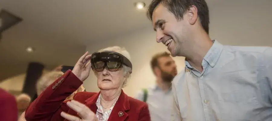 Lothian Birth Cohorts researcher with participant with AR glasses