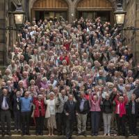 Cheerful group of LBC participants on steps